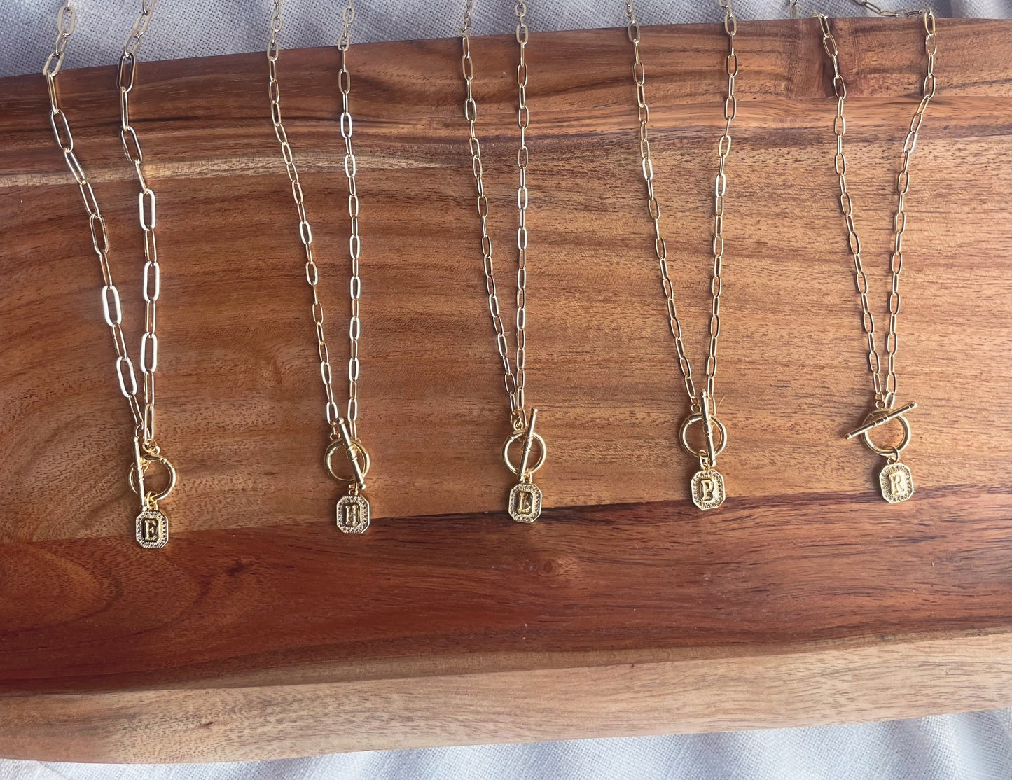 Initial charm necklaces